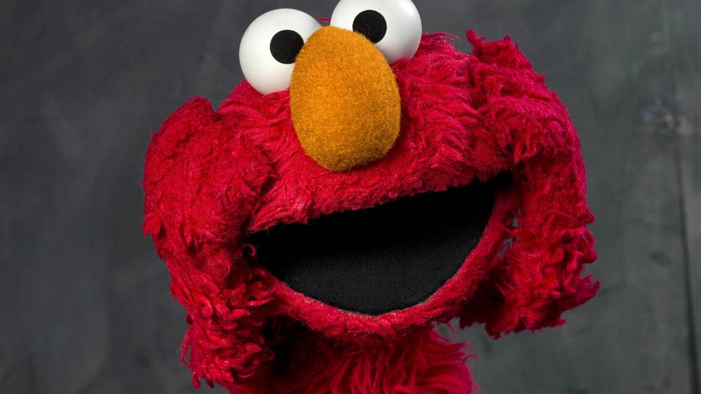 Elmo 3 joins youngest Americans in getting vaccinated AP News